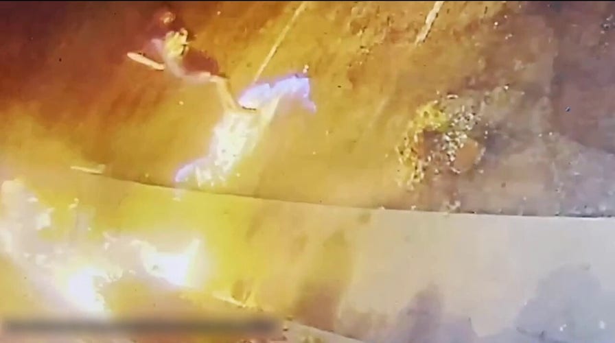 Florida surveillance videos shows man setting fire to church doors