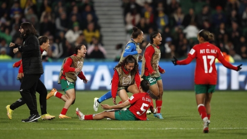 Morocco's head coach Reynald Pedros, left, and his players celebrate after the Women's World Cup Group H soccer match between Morocco and Colombia in Perth, Australia, Thursday, Aug. 3, 2023. (AP Photo/Gary Day)