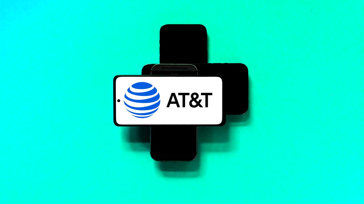 AT&T logo on a phone piled on other phones
