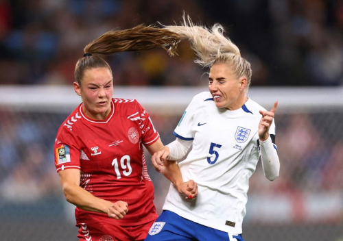 Denmark's Janni Thomsen, left, collides with England's Alex Greenwood.
