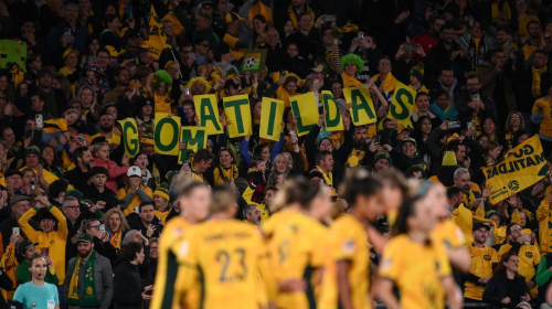 Australia fans wave placards during the match in Sydney. The team is nicknamed the Matildas.