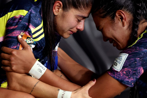 Colombia's Catalina Usme and Daniela Arias are dejected after the loss to England.