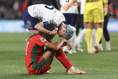 Megan Rapinoe consoles Portugal's Jessica Silva following the draw, which knocked Portugal out of the competition.