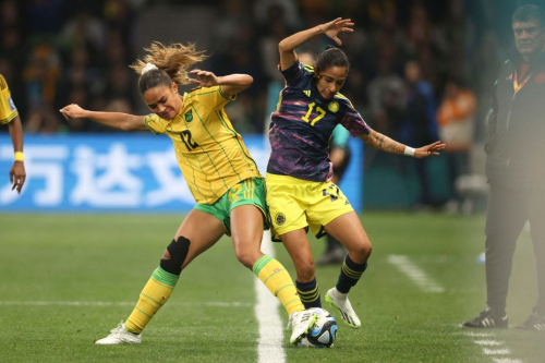 Jamaica's Kiki Van Zanten, left, and Colombia's Carolina Arias compete for the ball.