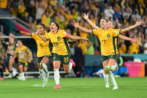 Australian players celebrate after Cortnee Vine scores her penalty in their penalty shootout against France, booking Australia's spot in the Women's World Cup semifinals.  