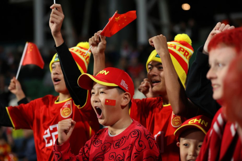 China fans show their support prior to their team's opening match against Denmark.