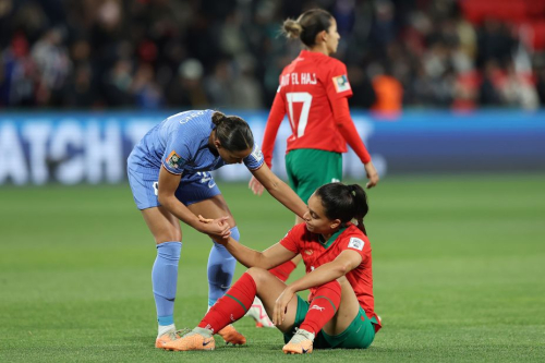 Morocco's Sakina Ouzraoui is consoled by France's Estelle Cascarino after the round-of-16 clash.