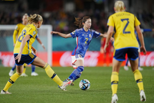 Japan's Risa Shimizu, center, runs with the ball during the game against Sweden. Japan's exit from the Women's World Cup ensured there will be a first-time champion in 2023.