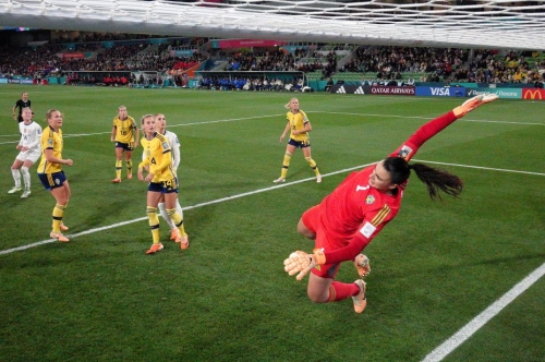 Taken from a remote camera, Sweden goalkeeper  Zecira Musovic dives in an attempt to save a Lindsey Horan header. 