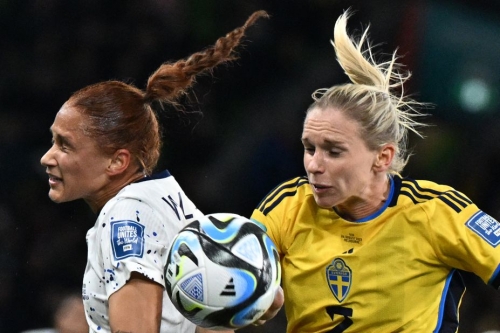USA's forward Lynn Williams, left, and Sweden's defender Jonna Andersson, right, fight for the ball during the Women's World Cup round of 16 football match between Sweden and USA in Melbourne on Sunday, August 6, 2023. 