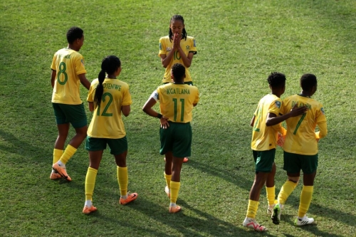 South Africa's Linda Motlhalo celebrates with teammates after scoring her team's first goal against Argentina. South Africa led 2-0 before Argentina's dramatic comeback.