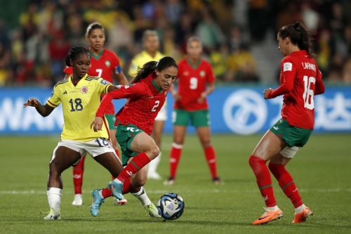 Colombia's teenage star Linda Caicedo, left, challenges Morocco's Zineb Redouani during their final Group H match. 