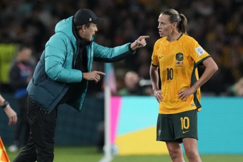 Australia's head coach Tony Gustavsson gives directions to Emily Van Egmond.