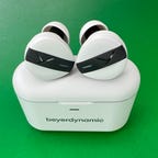 The white Beyerdynamic Free Byrd earbuds and their charging case