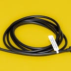 A coiled Plugable Active 2M USB-C cable with a white specifications label