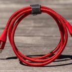 a coiled Anker 331 6ft USB-C to Lightning cable on a tabletop