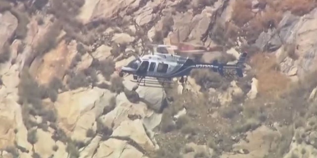 helicopter searching mountain