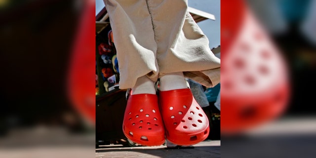 Pictured are red Crocs, similar to the ones Jacob Ortega wore when he allegedly robbed the Crumbl Cookies where he used to work.