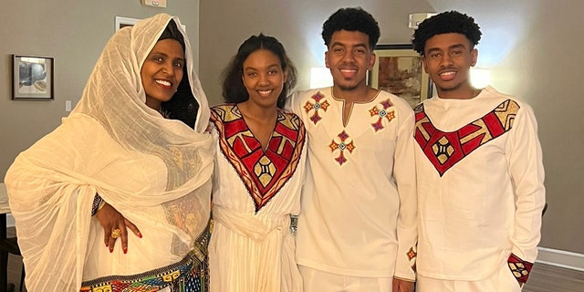 Yohanes and Yosief Kidane pose with mother and sister in family photos