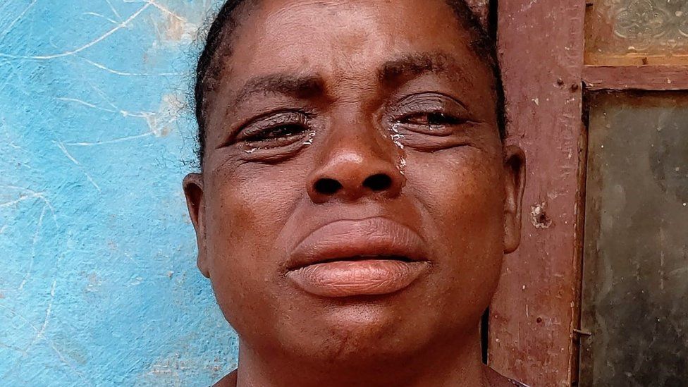A woman crying in Bamenda after her child was allegedly shot by police