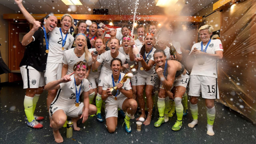 VANCOUVER, BC - JULY 05: Carli Lloyd of USA celebrates with the trophy and her team mates in the locker room after winning the FIFA Women's World Cup 2015 Final between USA and Japan at BC Place Stadium on July 5, 2015 in Vancouver, Canada. (Photo by Lars Baron - FIFA/FIFA via Getty Images)