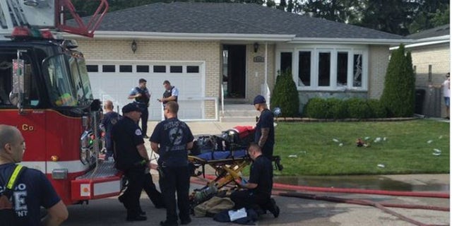 Firefighter on stretcher outside home