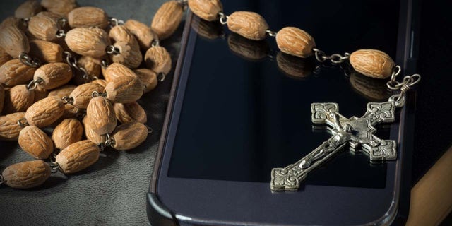 Rosary seen with smartphone