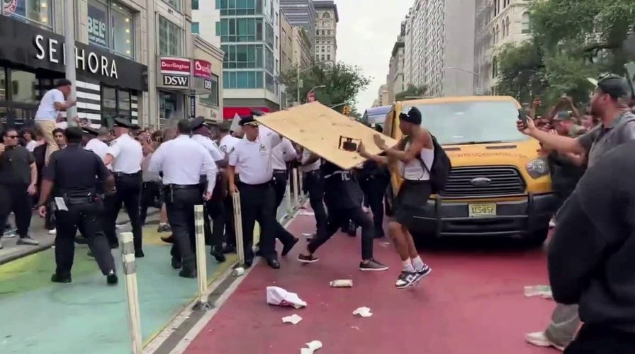 Teens in New York City seen throwing drinks at police during influencer's PlayStation giveaway