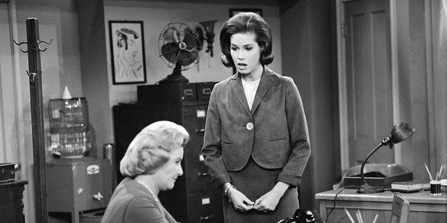 Mary Tyler Moore looking down at Rose Marie Marie