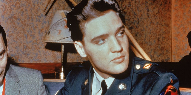 Elvis Presley wears US Army uniform