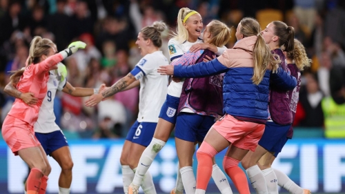 England's players celebrate reaching the last eight. 