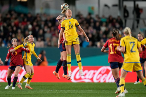 Sweden's Fridolina Rolfo jumps for a header with Spain's Alexia Putellas.