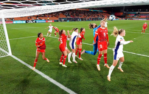 Switzerland players, in red, defend their box during a match against Norway on July 25. The match ended in a 0-0 draw.