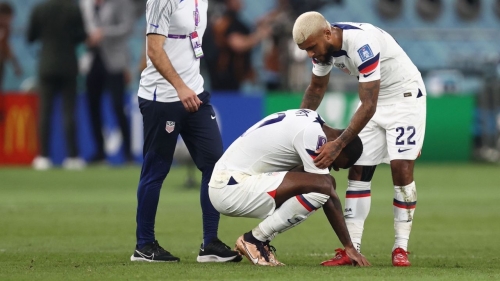 DOHA, QATAR - DECEMBER 03: Haji Wright of United States of America with DeAndre Yedlin of United States of America dejected at full time of the FIFA World Cup Qatar 2022 Round of 16 match between Netherlands and USA at Khalifa International Stadium on December 3, 2022 in Doha, Qatar. (Photo by James Williamson - AMA/Getty Images)