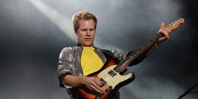 Andy Taylor plays guitar in Duran Duran concert