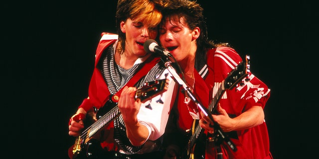 John Taylor and Andy Taylor play guitars