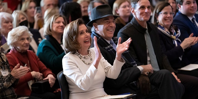 Rep. Nancy Pelosi, D-Calif., is joined by her family and husband Paul Pelosi as they attend her portrait unveiling ceremony in Statuary Hall at the Capitol in Washington, Dec. 14, 2022.