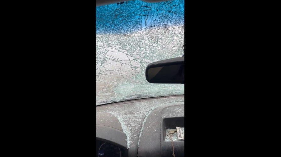 Huge chunks of hail hit windshield during severe storm