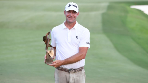 MEMPHIS, TENNESSEE - AUGUST 13: Lucas Glover of the United States poses with the trophy after putting in to win during the first playoff hole on the 18th green to win the tournament during the final round of the FedEx St. Jude Championship at TPC Southwind on August 13, 2023 in Memphis, Tennessee. (Photo by Gregory Shamus/Getty Images)