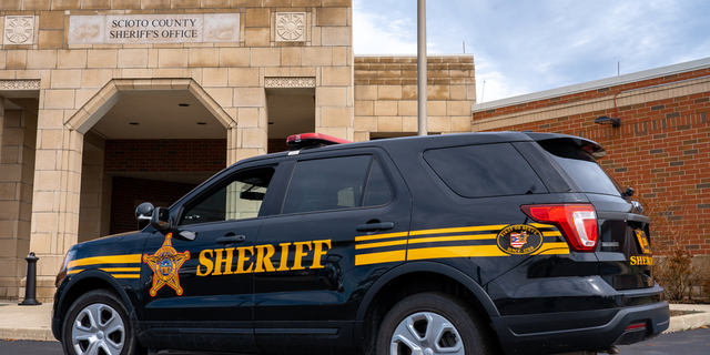 Sheriff 's SUV outside sheriff's office building