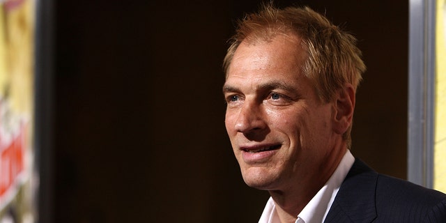 Julian Sands smiles for a photo