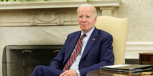 President Biden seated in Oval Office