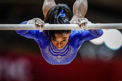 Biles competes on the uneven bars during the 2018 World Championships. She won gold in the individual all-around.