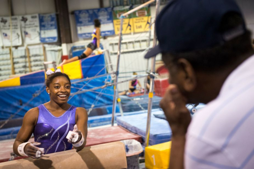 Biles talks with her grandfather, Ron, as she trains in Houston in August 2013. Biles grew up in Spring, Texas, just outside of Houston.