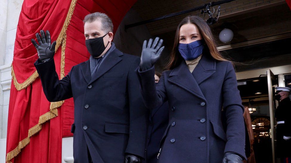 Hunter (left) and sister Ashley wave as they arrive at their father's presidential inauguration