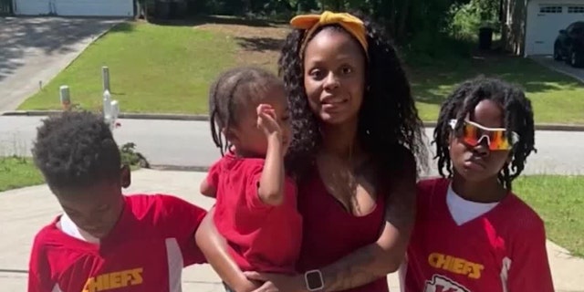 Imani Roberson pictured with her children