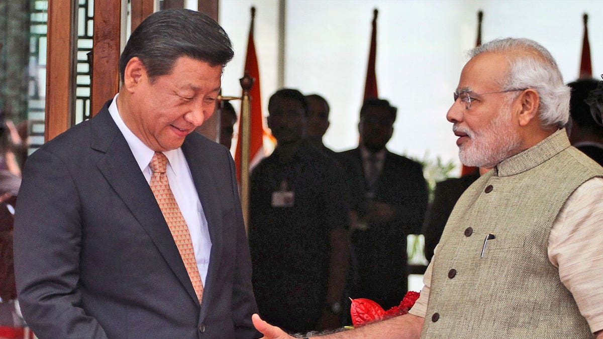Indian Prime Minister Narendra Modi welcomes Chinese President Xi Jinping