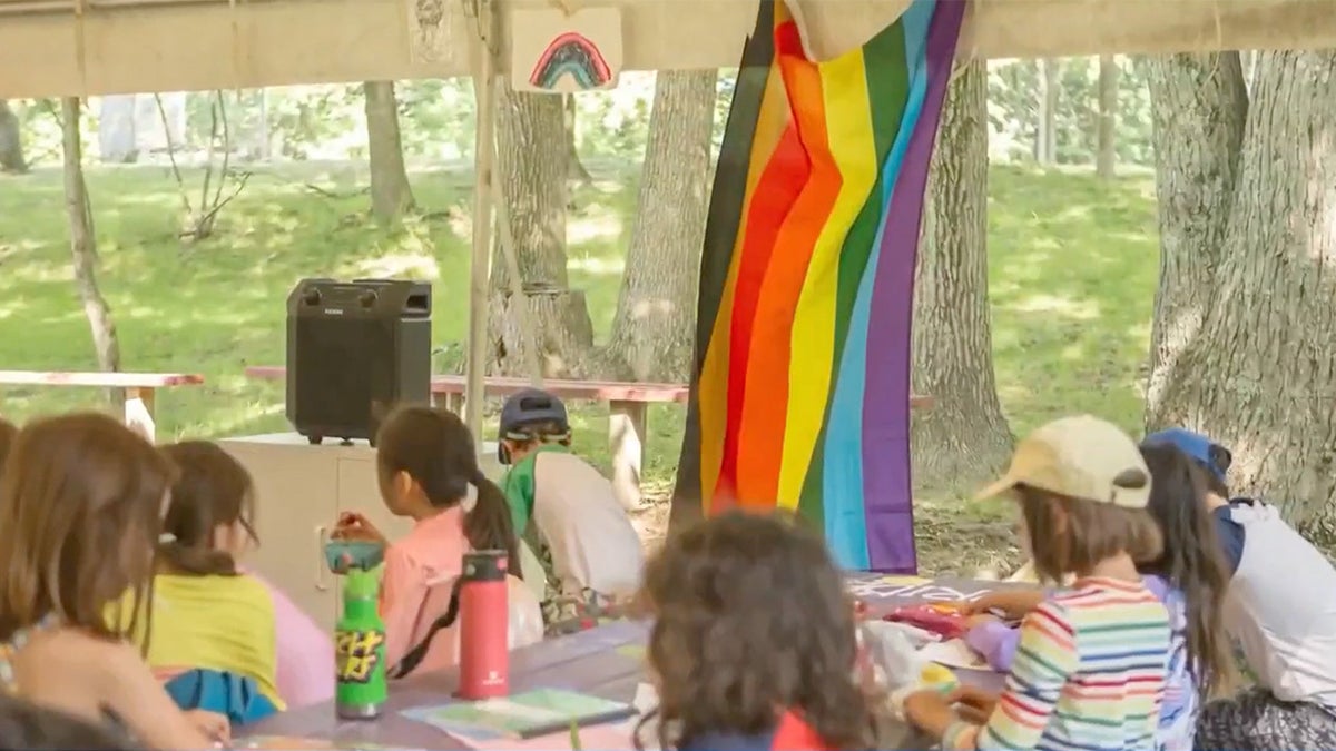 An LGBT flag at a summer camp