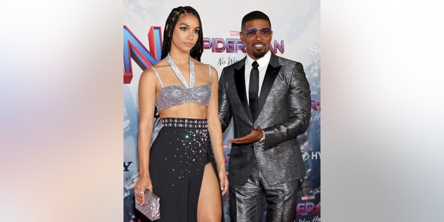 Corinne Foxx and Jamie Foxx on red carpet