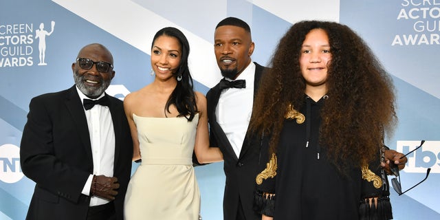 Left to right, George Dixon, Corinne Foxx, Jamie Foxx, and Anelise Bishop pose together